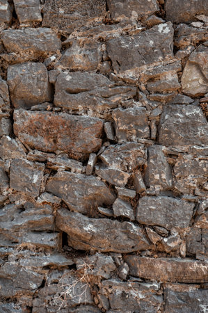 Ancient wall texture background with old concrete bricks and stonesの写真素材