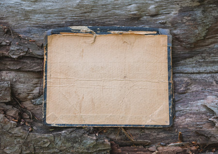Vintage empty paper lies on the old wooden texture backgroundの写真素材