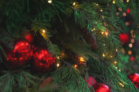 Festive pine tree decoration captured with a cozy, bokeh-filled background. Christmas backgroundの写真素材