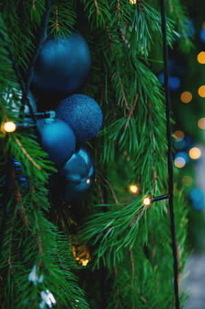 Festive pine tree decoration captured with a cozy, bokeh-filled background. Christmas backgroundの写真素材
