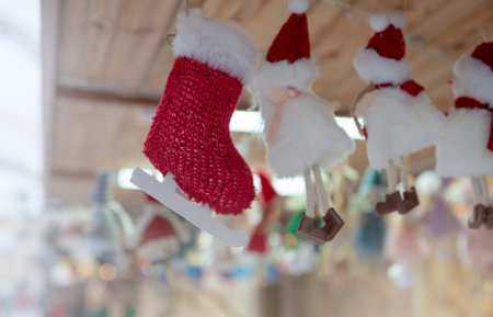 Christmas garland with skates and snowman hanging. Perfect for holiday, seasonal, and December street decor themesの写真素材