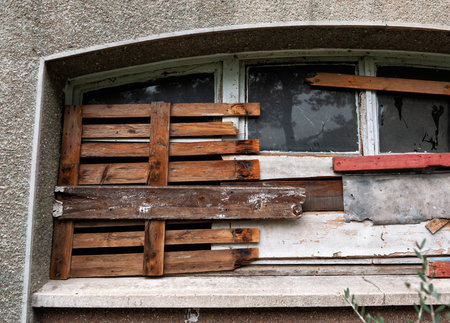 Old abandoned building exterior grunge texture with weathered windowの写真素材