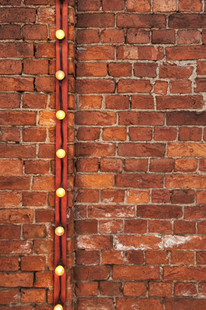 Brick wall background texture vintage with light bulb industrial decorの写真素材