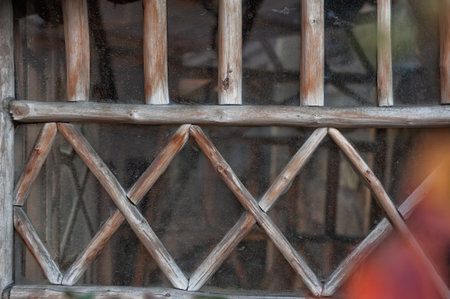 Rustic weathered wood lattice frames textured glass surface