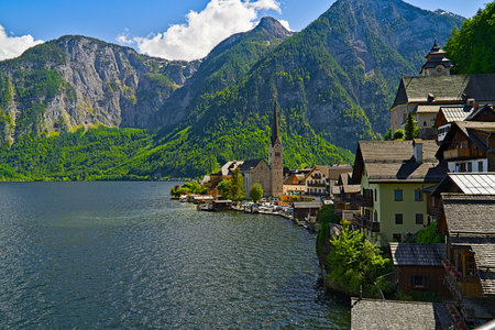 Hallstatt panoramic view with mountains in the background and sunsetの写真素材