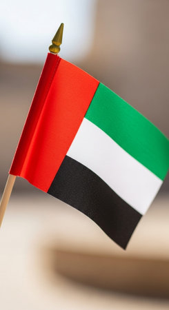 Flag of United Arab Emirates on a stick, close-up.の写真素材
