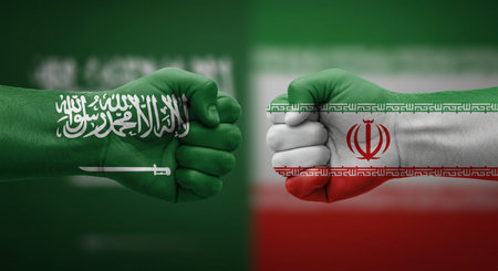 A pair of fists painted in the national flag of Iran and Iran. The concept of conflict between countries.の写真素材