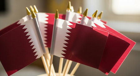 Flag of Qatar on wooden sticks. Close up. Selective focus.の写真素材