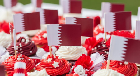 Qatar flag on cupcakes with red and white frosting.