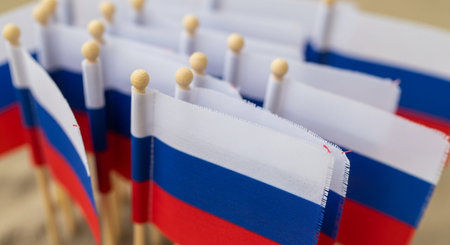 Close up of Russian national flags on a wooden table. Selective focus.