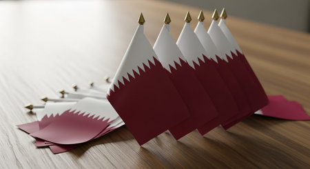 Qatar paper flags on a wooden table. 3D rendering.の写真素材