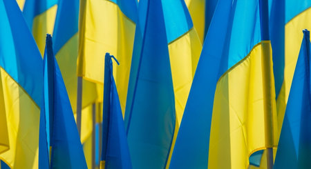 Ukrainian flags waving in the wind. Close-up.