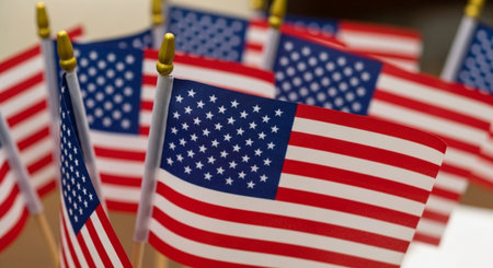 American flags on a white background. Close-up. Selective focus.