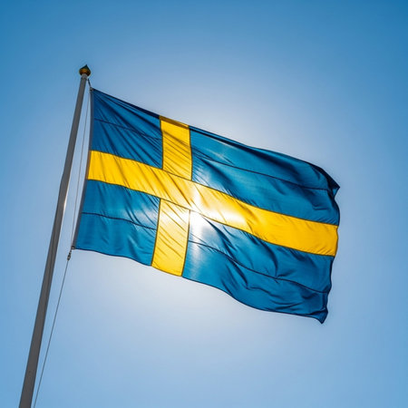 Sweden flag waving in the wind on blue sky background. Vertical image.の写真素材