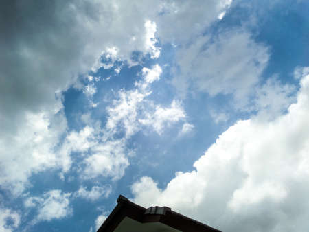 Blue sky and white cloud on top roofの写真素材