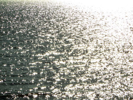 sunlight on surface of water in afternoonの写真素材