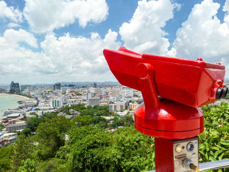 Red binocular stand on Pra tumnak hillの写真素材