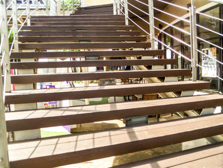 Wood stairs can walk to second floor and cross to opposite placeの写真素材