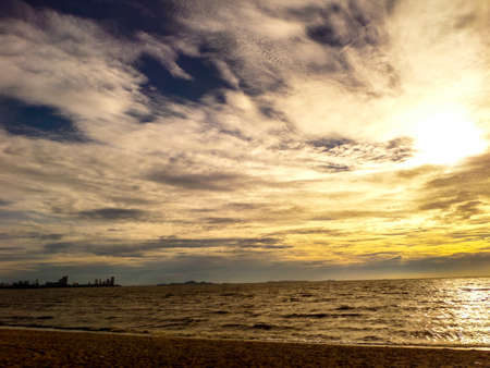 Sunset and dark cloud in the skyの写真素材