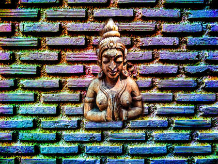 interior of angel wood carving and color brick backgroundの写真素材