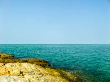 Coast and rock and blue sea in summerの写真素材