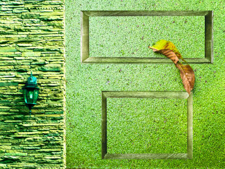 Lamp in middle green ancient stone pieces and two wood border and water fern and dry leaf on...