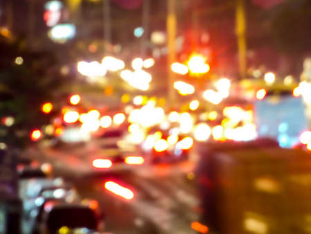 Bokeh and blur of traffic light and many vehicle on loadの写真素材