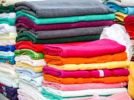have towels in lots of sizes, styles and colors and towel is a piece of absorbent fabric or paper used for drying or wiping the body or a surfaceの写真素材