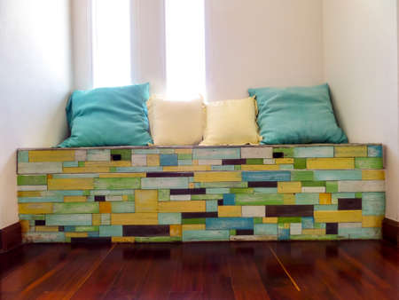 pillows on wood pieces becch random fancy color on surfaceの写真素材