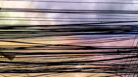 power electric lines and colorfull fantacy skyの写真素材