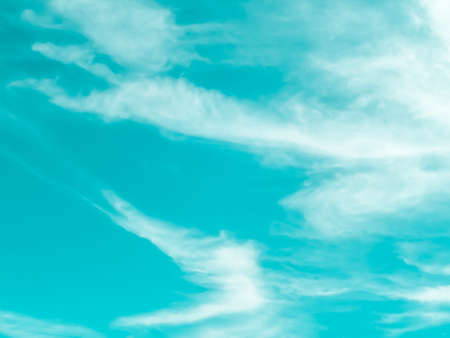 Soft cloud moving by wind and light blue sky backgroundの写真素材