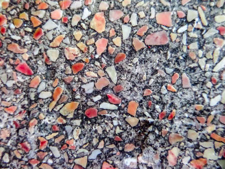 erosion and damage on surface of polished stone outdoor area