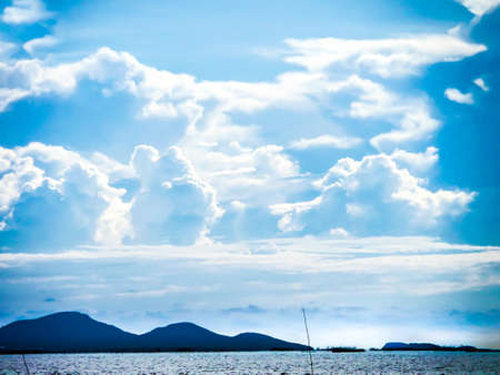 mountain of blue sky white cloud and sunlight in summer