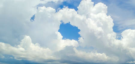 the hole of donut cloud sky and heaven sunshine a day and blue sky backgroundの写真素材