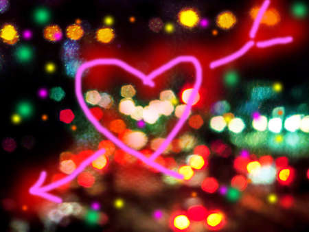 Night light, raindrop on mirror and heart arrow cupid blur traffic jam backroundの写真素材