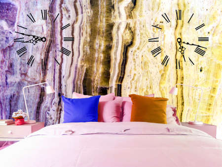 Lamp in middle green ancient stone pieces wall at left and smooth wall at rightの写真素材