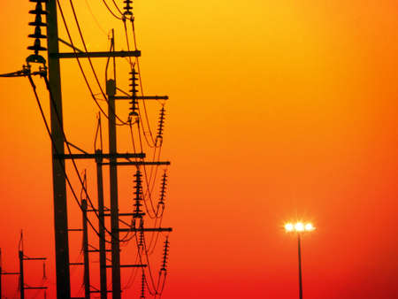 electric power line and last light of eveningの写真素材