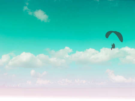paramotor travel in the blue sky white heap cloudの写真素材