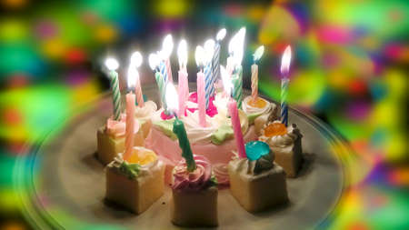Birthday cake and colorful blur light in partyの写真素材