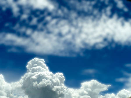 white heap cloud and blur light blue sky in the day