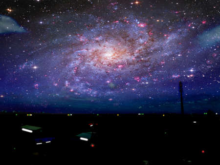 fisherman village and galaxy over dark sea in night skyの写真素材