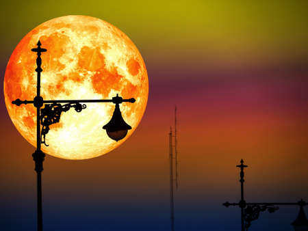 blood moon in color sky and silhouette top of lantern pillaの写真素材