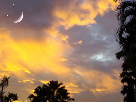 moon smile and light yellow cloud on evening sky.の写真素材