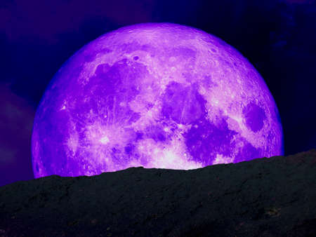 super purple moon back middle on mountainの写真素材