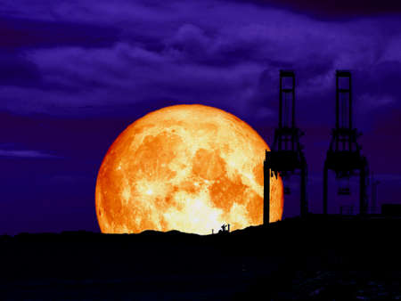 super full blood moon back mountain and silhouette crain at seaport, Elements of this image...