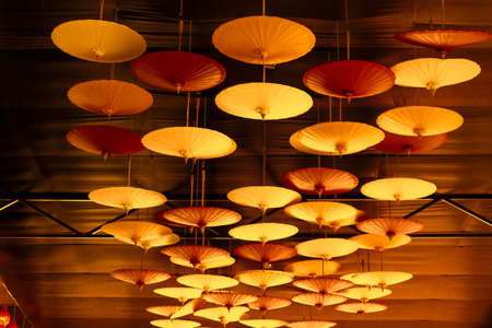colorful of hand made umbrella hang on ceiling to interior indoor