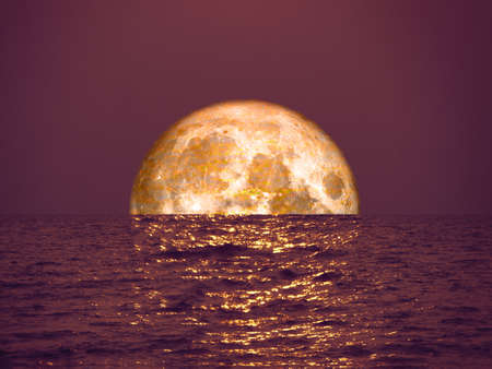 full blood moon light orange on sea and reflection moon light on surface