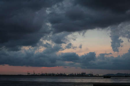 Saturn back cloud sky on sea and the cityの写真素材