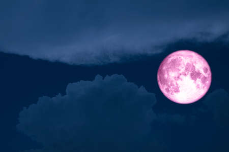 super moon between silhouette heap cloud night sky, Elements of this image furnished by NASAの写真素材