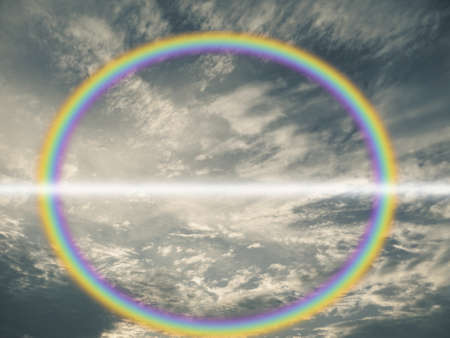 reflection of rainbow and cloud on lake water surfaceの写真素材